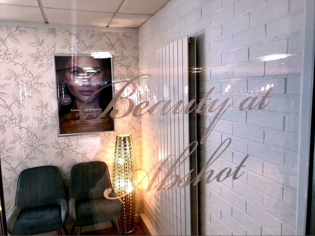 The etched glass entrance to Beauty at Abshot at Abshot Country Club